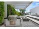 Backyard with outdoor kitchen including stainless grill, fire feature, and pool with a covered patio at 5301 N 43Rd St, Phoenix, AZ 85018