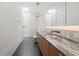 Bathroom with a skylight, marble countertop, walk-in shower, and bathtub at 5301 N 43Rd St, Phoenix, AZ 85018
