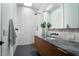 Bathroom features a modern glass shower, skylight, and marble countertop at 5301 N 43Rd St, Phoenix, AZ 85018