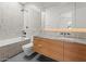 Bathroom featuring a bathtub, walk-in shower, and modern marble countertop at 5301 N 43Rd St, Phoenix, AZ 85018
