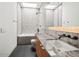 Modern bathroom featuring a shower, bathtub, skylight and marble countertop at 5301 N 43Rd St, Phoenix, AZ 85018