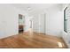 Well-lit bedroom with hardwood floors and a modern ensuite bathroom at 5301 N 43Rd St, Phoenix, AZ 85018