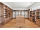 Spacious walk-in closet with custom shelving, an island, and plenty of storage space for organization at 5301 N 43Rd St, Phoenix, AZ 85018