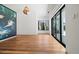 Bright living room with hardwood floors, a large sliding door, and picturesque desert views at 5301 N 43Rd St, Phoenix, AZ 85018