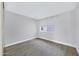 Clean bedroom with light-colored walls, modern flooring, and a window providing natural light at 616 S Hardy Dr # 203, Tempe, AZ 85281