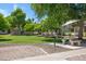 Well-maintained community area with a picnic table, benches and barbeque at 616 S Hardy Dr # 203, Tempe, AZ 85281