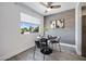 Dining area with modern furnishings, accented wall, and natural light at 616 S Hardy Dr # 203, Tempe, AZ 85281