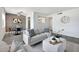 Modern living room with stylish furniture, gray flooring, and decorative accents at 616 S Hardy Dr # 203, Tempe, AZ 85281