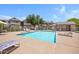 Community pool area with seating and clear blue water at 616 S Hardy Dr # 203, Tempe, AZ 85281