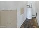 Unfinished storage room with a modern water heater system at 616 S Hardy Dr # 203, Tempe, AZ 85281