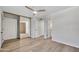 Bright bedroom with wood-look floors, a ceiling fan, closet with sliding mirrored doors at 6415 S Newberry Rd # A, Tempe, AZ 85283