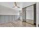 Inviting bedroom with stylish floors, a modern ceiling fan and sliding door closet at 6415 S Newberry Rd # A, Tempe, AZ 85283