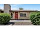 Charming single-story home with a red front door, brick facade, and well-maintained landscaping at 6415 S Newberry Rd # A, Tempe, AZ 85283