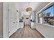Modern kitchen featuring white cabinets, light countertops, and a large window with outdoor views at 6415 S Newberry Rd # A, Tempe, AZ 85283