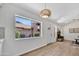 Bright living room with a decorative fireplace, natural light, and wood-look floors at 6415 S Newberry Rd # A, Tempe, AZ 85283