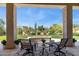 Inviting back patio with comfortable seating and a cozy fire pit, perfect for outdoor relaxation at 6450 E Monterra Way, Scottsdale, AZ 85266