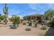 Serene backyard featuring desert landscaping, a patio, and lush greenery creates a private outdoor oasis at 6450 E Monterra Way, Scottsdale, AZ 85266