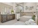 Bright bathroom featuring dual sink vanity, tiled shower and soaking tub enhanced by decorative elements at 6450 E Monterra Way, Scottsdale, AZ 85266