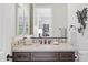 Bathroom featuring vanity with light countertop and decorative backsplash, seen from doorway at 6450 E Monterra Way, Scottsdale, AZ 85266