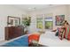 Bright primary bedroom featuring modern furniture, large mirror, and natural light from windows at 6450 E Monterra Way, Scottsdale, AZ 85266