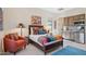 Southwestern-style bedroom featuring colorful accent pillows, blankets and cozy chair at 6450 E Monterra Way, Scottsdale, AZ 85266