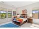 Colorful bedroom featuring a vibrant bedspread, bedside table, and bright artwork at 6450 E Monterra Way, Scottsdale, AZ 85266