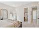 Comfortable primary bedroom featuring ensuite bathroom and walk-in closet at 6450 E Monterra Way, Scottsdale, AZ 85266