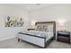 Comfortable bedroom with floral bedding, two side tables, lamps and accent wall art at 6450 E Monterra Way, Scottsdale, AZ 85266