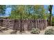 Stone wall with 'Paseo Las Colinas' sign, marking the entrance to a beautiful community at 6450 E Monterra Way, Scottsdale, AZ 85266