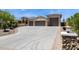 Spacious driveway leading to a home with a three-car garage, perfect for car enthusiasts at 6450 E Monterra Way, Scottsdale, AZ 85266