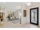 Bright foyer with tile floors and modern decor leads to the living area, creating a seamless transition at 6450 E Monterra Way, Scottsdale, AZ 85266