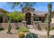 Charming front entrance with a secure gated courtyard and desert landscaping at 6450 E Monterra Way, Scottsdale, AZ 85266