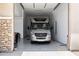 Clean garage with an RV parked inside; the floor has an epoxy coating for easy maintenance at 6450 E Monterra Way, Scottsdale, AZ 85266