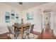 Dining area features wood floors, neutral walls, and artwork for a cozy ambiance at 740 W Elm St # 266, Phoenix, AZ 85013