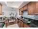 Open kitchen view includes a dining area, hardwood floors, and unique backsplash at 740 W Elm St # 266, Phoenix, AZ 85013