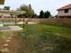 Expansive backyard with a pool, patio, pergola, block wall, and ample green space at 7537 W Dreyfus Dr, Peoria, AZ 85381