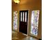 Entry way with decorative stained glass sidelight windows at 7537 W Dreyfus Dr, Peoria, AZ 85381