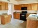 Functional kitchen with granite countertops, cabinets, and appliances at 7537 W Dreyfus Dr, Peoria, AZ 85381