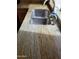 Close-up of a dual stainless sink set in granite countertop with stylish faucet and soap dispenser at 7537 W Dreyfus Dr, Peoria, AZ 85381