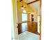 Bright living room showcasing hardwood floors and ample natural light with kitchen in the background at 7537 W Dreyfus Dr, Peoria, AZ 85381