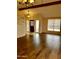 Bright living room with wood floors, a vaulted ceiling and an entry way with decorative windows at 7537 W Dreyfus Dr, Peoria, AZ 85381