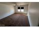 Bedroom featuring neutral paint and carpet, and natural light at 8254 E Posada Ave, Mesa, AZ 85212