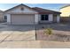Charming home with well-maintained lawn and attractive curb appeal with desert landscaping at 8254 E Posada Ave, Mesa, AZ 85212