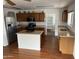 Kitchen featuring wood cabinets, granite counters, and stainless steel appliances and an island at 8254 E Posada Ave, Mesa, AZ 85212