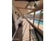 Relaxing enclosed patio overlooking the sparkling swimming pool and green landscaping at 8254 E Posada Ave, Mesa, AZ 85212