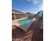 Sparkling swimming pool surrounded by lush greenery and a serene outdoor setting at 8254 E Posada Ave, Mesa, AZ 85212