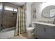 Bright bathroom featuring tile floors, granite countertops, and shower and tub combination at 839 W Silver Creek Rd, Gilbert, AZ 85233