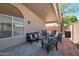 Covered patio featuring comfortable seating, dining space, and stylish outdoor decor at 839 W Silver Creek Rd, Gilbert, AZ 85233