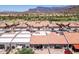 Enjoy the view of this townhome community featuring mature landscaping and red tile roofs at 8785 E Greenview Dr, Gold Canyon, AZ 85118