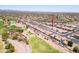 This aerial view showcases the community's lush golf course adjacent to the townhomes at 8785 E Greenview Dr, Gold Canyon, AZ 85118